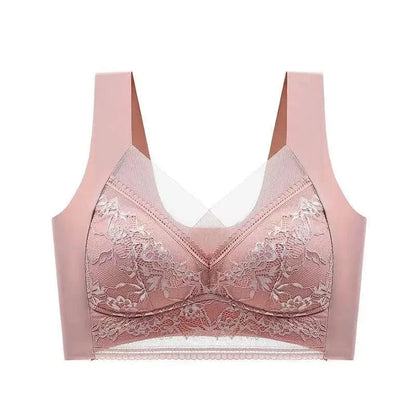 A dusty pink wireless bra featuring molded cups with floral lace overlays and a semi-sheer mesh panel at the neckline and bottom band.